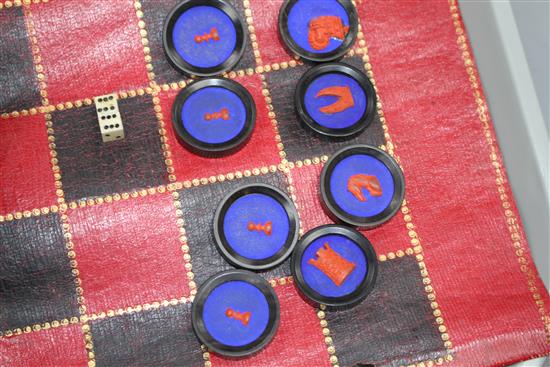 A 19th century Jaques Patent portable B.C.D. backgammon, chess and draughts board set, the gilt tooled red morocco cylinder holder
